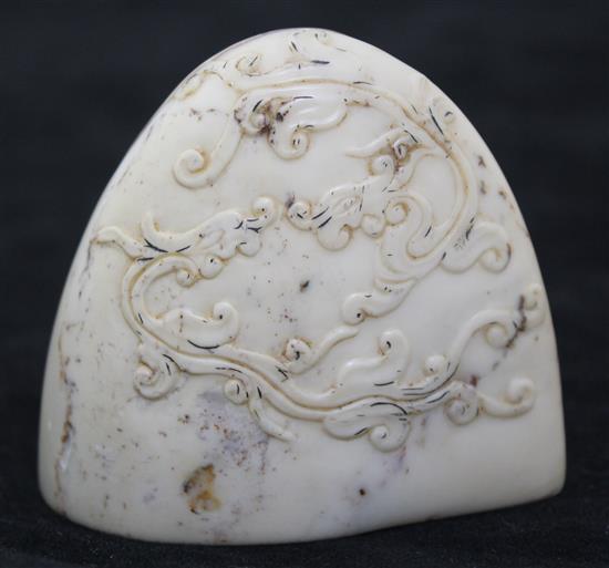 A Chinese cream and red soapstone seal, 6.3cm